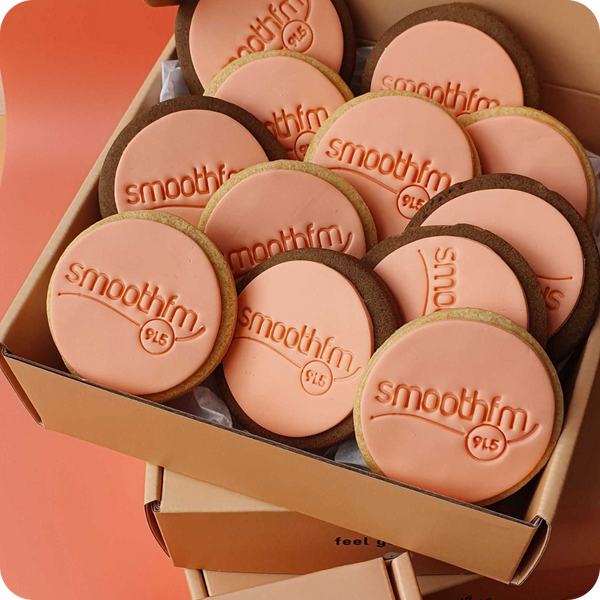 Round custom logo cookie with personalised fondant design