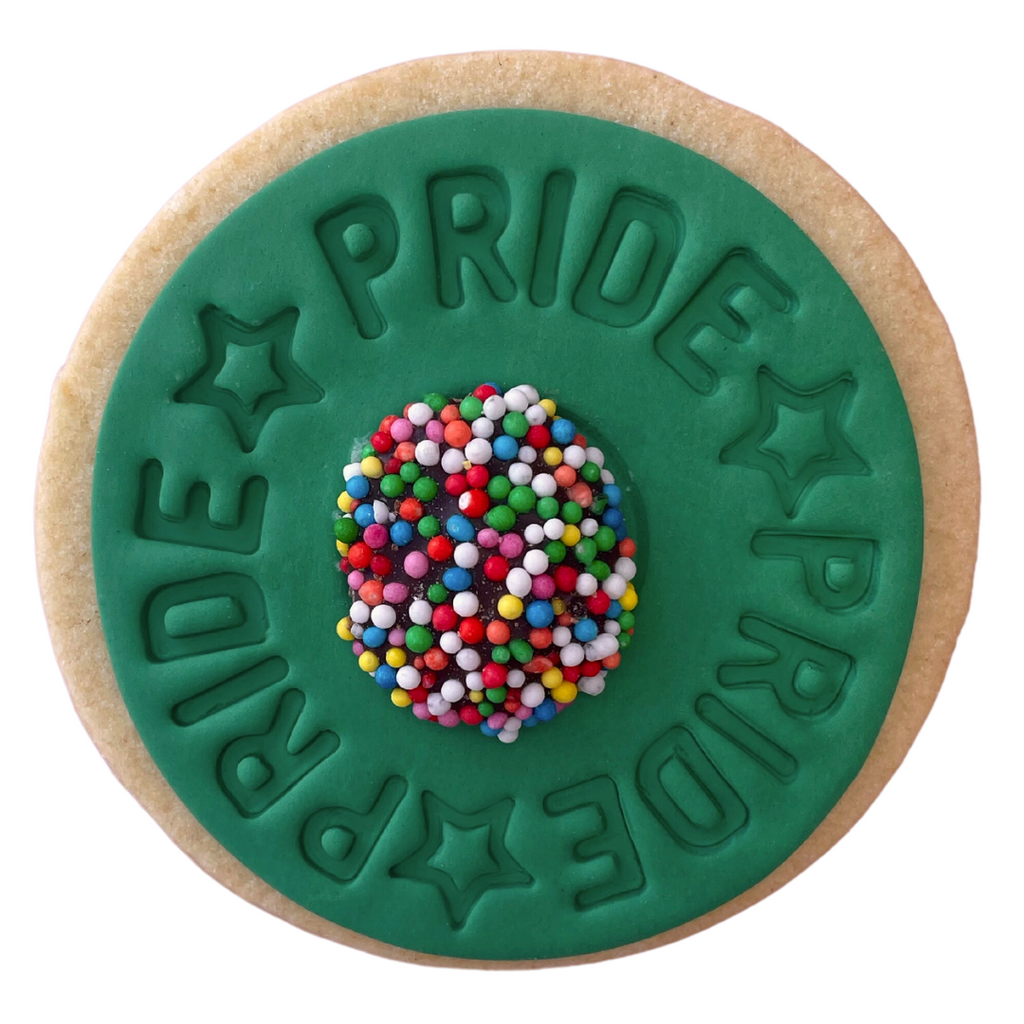 Sweet Mickie Pride Cookies with Pride quote and star detail, a chocolate freckle on green icing and a vanilla shortbread cookie