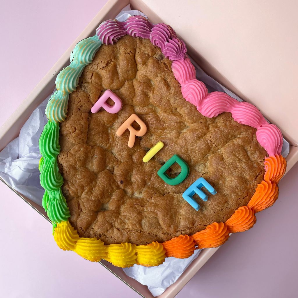 Sweet Mickie Pride Cookie Cake with Pride quote and rainbow frill icing - white chocolate blondie cake