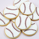 Handcrafted baseball cookies decorated with white fondant and red stitching