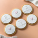 Personalised birth announcement cookies featuring a baby's name, birth date and embossed baby footprints