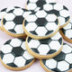 Handcrafted soccer ball cookies decorated with white fondant and black football pattern