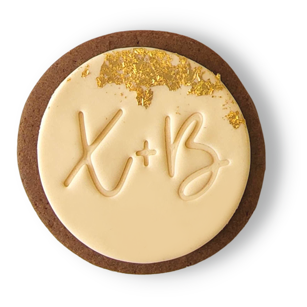 Sweet Mickie wedding cookies with custom initials and gold leaf